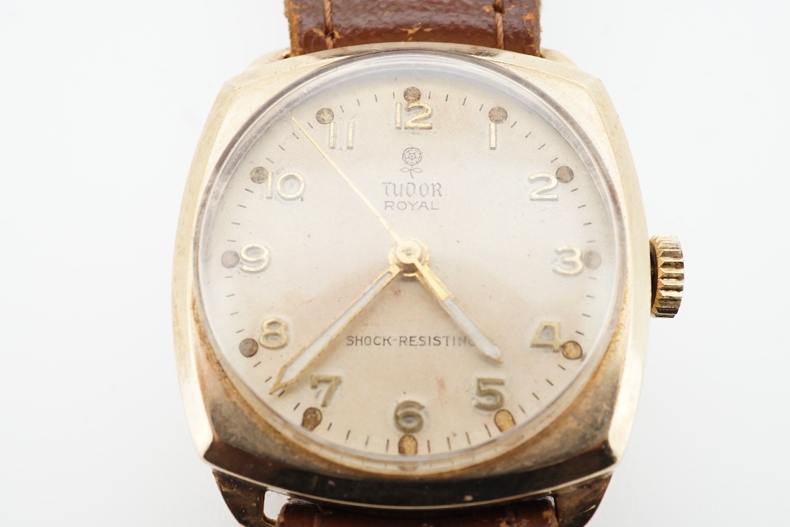 A 1950's 9ct gold Tudor Royal manual wind wrist watch, with Arabic dial, case diameter 27mm, with case back inscription, on a later associated strap.